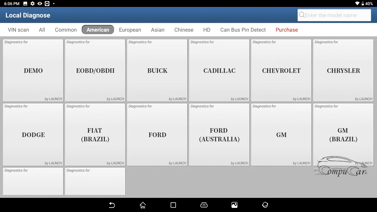 Launch X431 PAD connected to an American car, such as a Ford or Chevrolet, for diagnostics and repair.