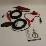 Autel PowerScan PS100 electrical probe, power cables, alligator clips, and user manual layout.