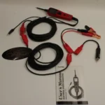 Full Autel PowerScan PS100 kit laid out, including the electrical system diagnostics instruction manual.