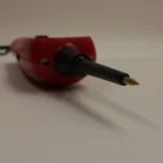 Close-up shot of the sharp test probe tip of the Autel PowerScan PS100.