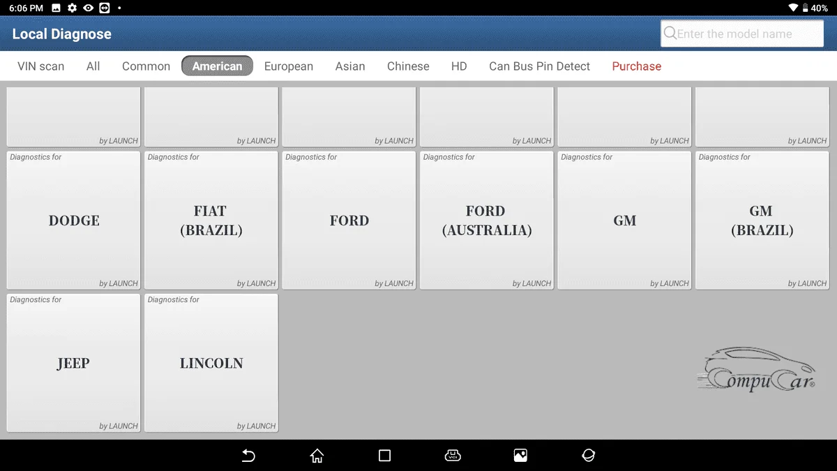 A Launch X431 PAD device being used to diagnose an American car, showcasing the tool's compatibility with various US car brands.