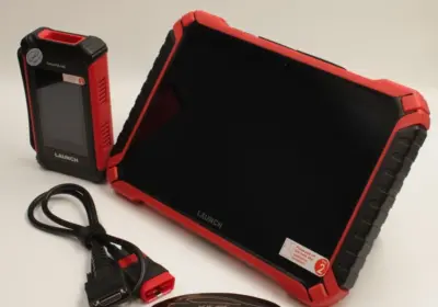 Launch X431 Pad IX full diagnostic device standing with SmartLink VCI