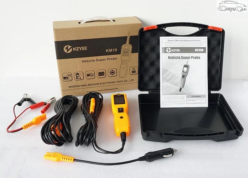 KM10 powerscan automotive tool with its various cables and accessories.