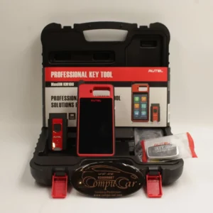 صورة تُظهر جهاز Autel KM100 لنسخ مفاتيح السيارات ومحتوياته، تشير إلى افضل سعر في السعودية من كومبيوكار.