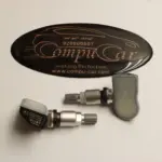 حساسات إطارات أوتيل مع أغطية حماية وشعار كومبيوكار.