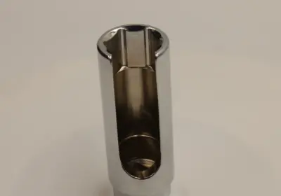 Oxygen sensor socket slotted opening for sensor wire